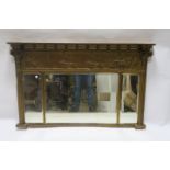 A REGENCY GILTWOOD AND GESSO COMPARTMENT OVERMANTEL MIRROR,