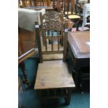 A PAIR OF OAK CARVED SIDE CHAIRS the rectangular open backs with foliate pierced frieze spindle