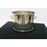 A SILVER PLATED CHAMPAGNE COOLER, of oval outline enscribed Alfred - Gratien, 20cms high.