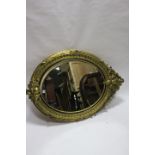 A VICTORIAN STYLE GILT FRAMED OVAL OVERMANTEL,