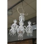 AN EIGHT ARM CUT GLASS TARA CRYSTAL CHANDELIER with scrolled arms foliate cut drip pans hung with