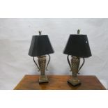 A PAIR OF COMPOSITION AND GILT BRASS MOUNTED TABLE LAMPS, in the form of classical lions,