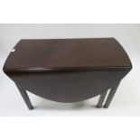 A GOOD 19TH CENTURY MAHOGANY DROP LEAF TABLE the oval top raised on square cut chamfered supports