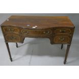 A GEORGIAN MAHOGANY BOWFRONT DESK the plain top with satinwood border canted corners and moulded