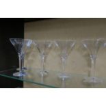 A SET OF FIVE JOHN ROCHA WATERFORD CRYSTAL MARTINI GLASSES