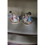 A PAIR OF CONTINENTAL GLAZED PORCELAIN GROUPS,