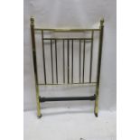 A GEORGIAN STYLE SINGLE BRASS BED, the rectangular tubular frame headed by classical urns,