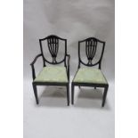 A SET OF EIGHT REGENCY STYLE MAHOGANY DINING ROOM CHAIRS EN SUITE the shield shaped backs decorated