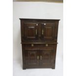 AN 18TH CENTURY OAK CARVED DRESSER the rectangular top with a pair of panelled doors above the