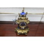 A CONTINENTAL GILT BRASS AND PORCELAIN INLAID MANTLE CLOCK,