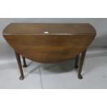 A GOOD GEORGIAN IRISH MAHOGANY DROP LEAF TABLE the oval hinged top on cabriole legs with pad feet