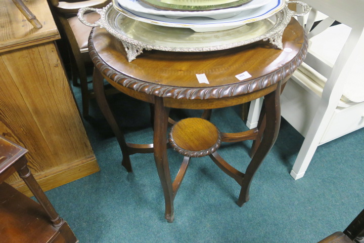 A MAHOGANY OCCASSIONAL TABLE, with circular top and gadrooned rim on moulded legs, 79cms x 74cms.