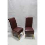 A SET OF SIX WINE LEATHER UPHOLSTERED DINING ROOM CHAIRS,