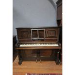 A DANEMANN MAHOGANY INLAID CASED UPRIGHT PIANO, together with a round table.