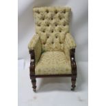 A MAHOGANY UPHOLSTERED ARMCHAIR buttoned upholstered back and sides close upholstered seat on ring