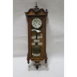 A KINGWOOD AND WALNUT CASED CLOCK,