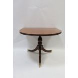 A GOOD REGENCY STYLE MAHOGANY AND SATINWOOD INLAID THREE POD D-END DINING ROOM TABLE the