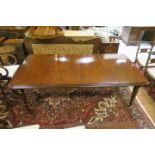 A VICTORIAN MAHOGANY DINING ROOM TABLE the rectangular top with moulded rim raised on ring turned