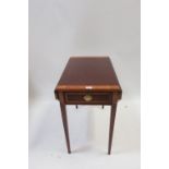 A GEORGIAN STYLE MAHOGANY CROSS BANDED DROP LEAF TABLE the rectangular top with canted corners