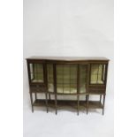 A GOOD EDWARDIAN MAHOGANY DISPLAY CABINET of rectangular bowed outline with astragal glazed doors