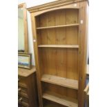 A PINE BOOKCASE,