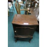 A GEORGIAN STYLE MAHOGANY BOWED CUPBOARD the rectangular top with moulded rim above a single