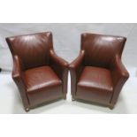 TWO RED LEATHER ARMCHAIRS