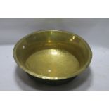 A CIRCULAR BRASS BASIN, of large proportions with engraved rim.