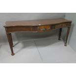 A 19TH CENTURY MAHOGANY CONSOLE TABLE the serpentine shaped top above a fluted frieze centred by a