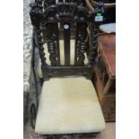 A SET OF FOUR JABOBEAN STYLE CARVED OAK SIDE CHAIRS,
