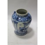 AN ORIENTAL BLUE AND WHITE VASE, of ovoid form decorated with stylised flower heads and foliage,