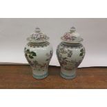 A PAIR OF ORIENTAL STYLE WHITE GLAZED URN AND COVERS,
