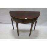 A 19TH CENTURY MAHOGANY AND SATINWOOD BANDED D SHAPED FOLD OVER TOP SUPPER TABLE the recessed