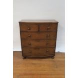 A 19th CENTURY MAHOGANY BOWED CHEST OF DRAWERS,
