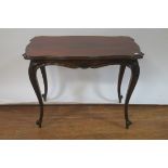 A VICTORIAN MAHOGANY OCCASIONAL TABLE the rectangular top with waved sides and rounded corners