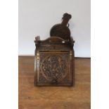 AN EDWARDIAN OAK CARVED COAL SCUTTLE, of rectangular tapering form carved with celtic motifs,