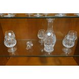 A SET OF FIVE WATERFORD CUT GLASS BRANDY BALLOONS of typical form with diamond cut bowl on circluar