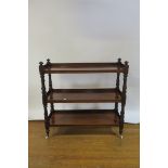 A VICTORIAN MAHOGANY THREE TIER DUMB WAITER OF RECTANGULAR FORM the plain shelves between ring