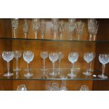 A SET OF TWELVE WATERFORD CUT GLASS WINE GLASSES (en suite to previous lot) the circular bowl on