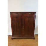 A MAHOGANY FRAMED 19TH CENTURY LINEN PRESS the moulded cornice above a plain frieze,