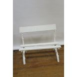 A PAIR OF WHITE PAINTED CAST IRON GARDEN SEATS the frames modelled as tree bough applied with