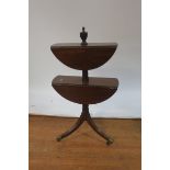 A MAHOGANY TWO TIER DROP LEAF DUMB WAITER, surmounted with a neo-classical urn,