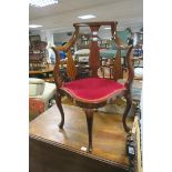 A GOOD EDWARDIAN MAHOGANY CORNER CHAIR the moulded top rail above a solid vase shaped splat with