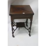 AN EDWARDIAN MAHOGANY ENVELOPE GAMES TABLE the rectangular hinged top opening to reveal a green