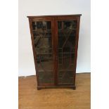 AN EDWARDIAN MAHOGANY AND MARQUETRY INLAID DISPLAY CABINET rectangular top above a pair of long