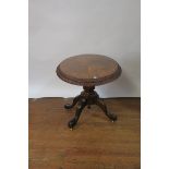 A VICTORIAN WALNUT VENEERED OCCASIONAL TABLE the oval top with double gadrooned rim raised on a