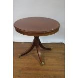 A REGENCY STYLE MAHOGANY AND MARQUETRY INLAID CIRCULAR TABLE the top with moulded rim and stainwood