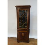 A GEORGIAN STYLE MAHOGANY INLAID CORNER CABINET the moulded corners above a dental frieze with