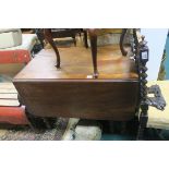 A VICTORIAN MAHOGANY DROP LEAF TABLE on turned legs 66cm X 98cm X 63cm