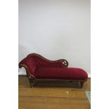 A VICTORIAN MAHOGANY CHAISE-LONGUE the moulded and scrolled frame with buttoned upholstered back